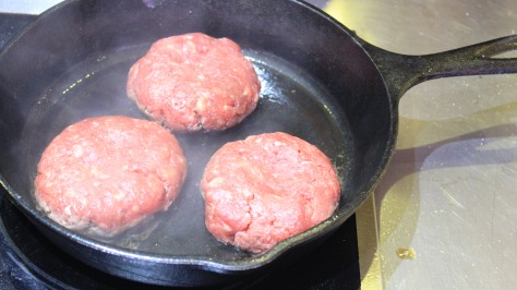 A smoking hot iron skillet is key to excellent burgers.